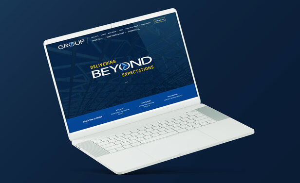 GROUP NEW Website on Laptop